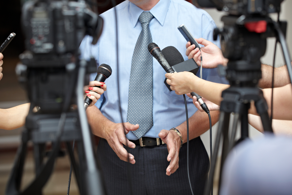 close up of conference meeting microphones and businessman-1